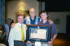 Leonard Hansen with John & Lance Armstrong and American flag made at POW camp